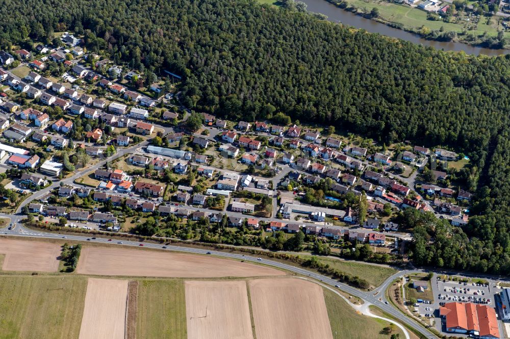 Aerial image Kreuzwertheim - Surrounded by forest and forest areas center of the streets and houses and residential areas in Kreuzwertheim in the state Bavaria, Germany