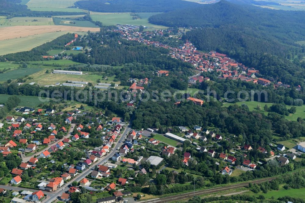 Langenstein from the bird's eye view: Surrounded by forest and forest areas center of the streets and houses and residential areas in Langenstein in the state Saxony-Anhalt, Germany