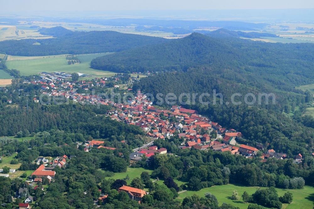 Aerial image Langenstein - Surrounded by forest and forest areas center of the streets and houses and residential areas in Langenstein in the state Saxony-Anhalt, Germany