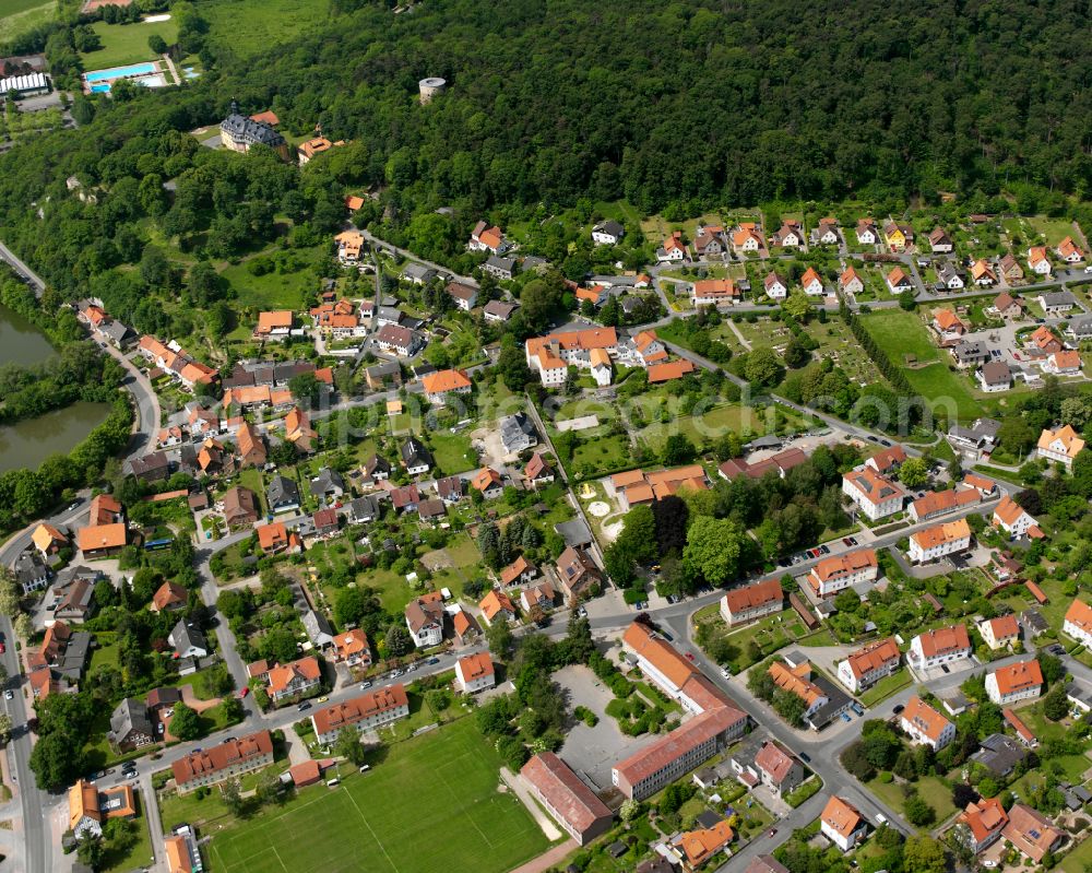 Aerial photograph Liebenburg - Surrounded by forest and forest areas center of the streets and houses and residential areas in Liebenburg in the state Lower Saxony, Germany