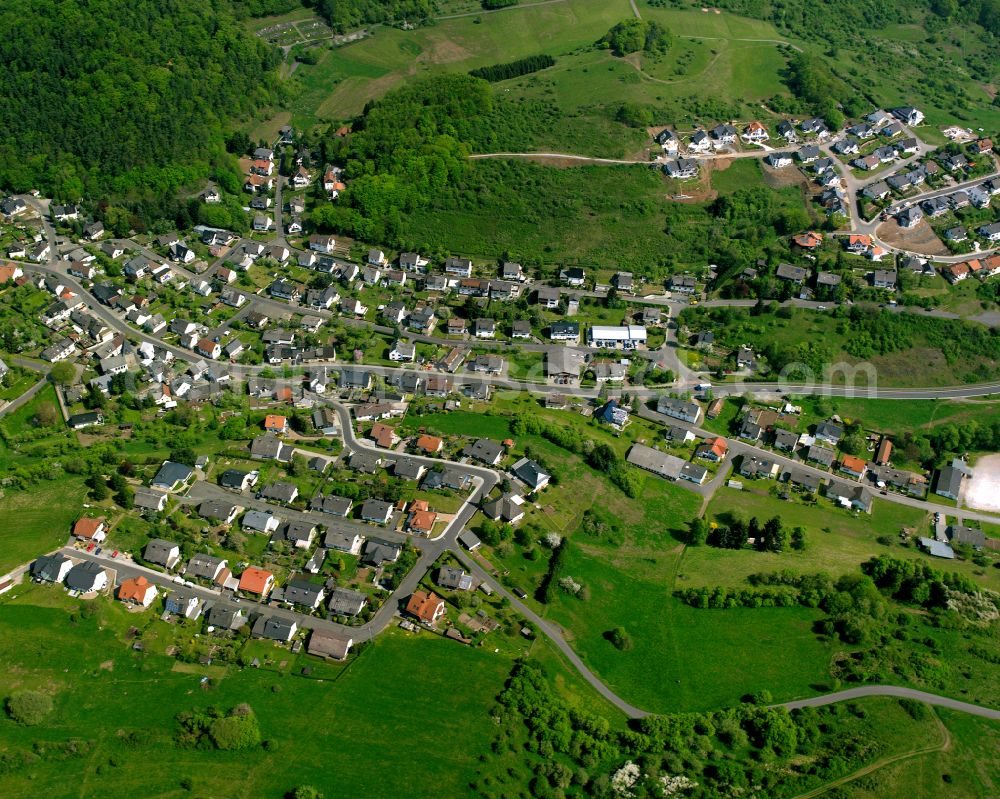 Aerial image Medenbach - Surrounded by forest and forest areas center of the streets and houses and residential areas in Medenbach in the state Hesse, Germany