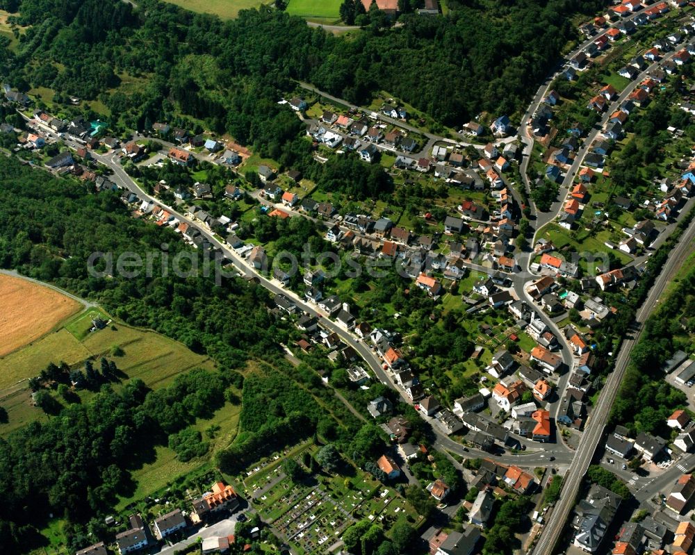 Aerial image Nahbollenbach - Surrounded by forest and forest areas center of the streets and houses and residential areas in Nahbollenbach in the state Rhineland-Palatinate, Germany