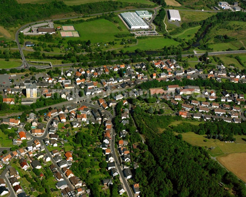 Nahbollenbach from the bird's eye view: Surrounded by forest and forest areas center of the streets and houses and residential areas in Nahbollenbach in the state Rhineland-Palatinate, Germany