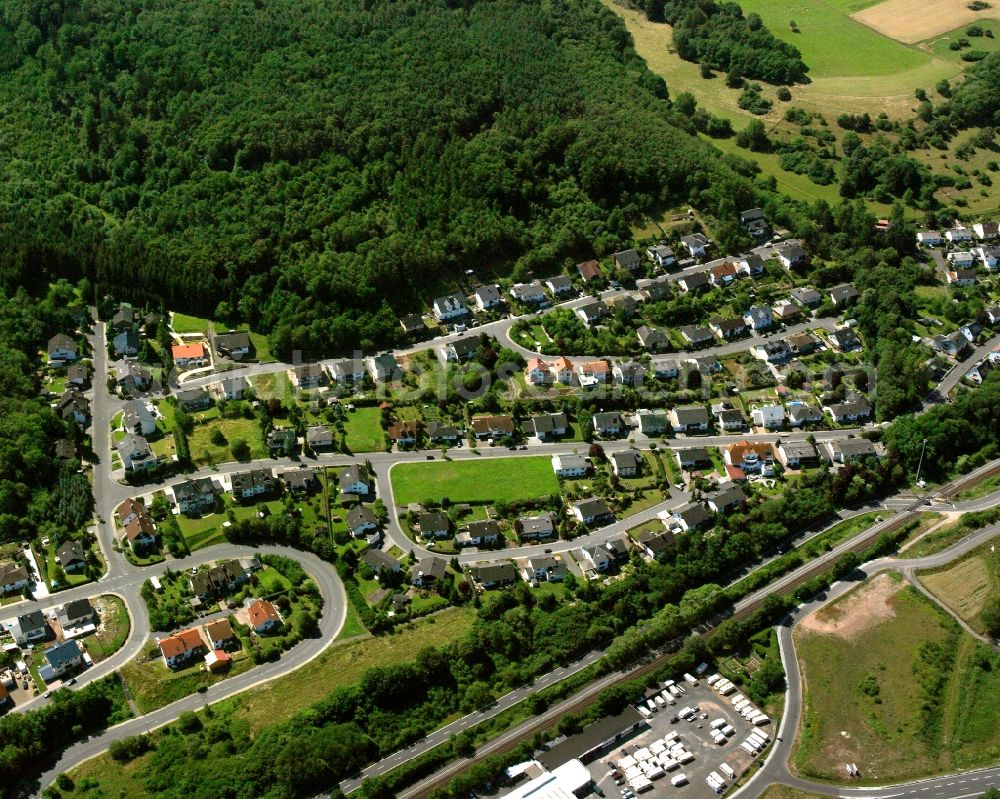 Aerial image Nahbollenbach - Surrounded by forest and forest areas center of the streets and houses and residential areas in Nahbollenbach in the state Rhineland-Palatinate, Germany