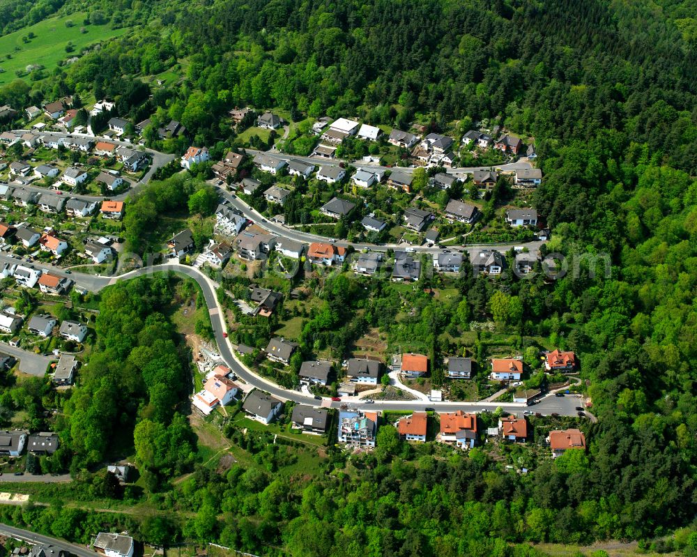 Niederscheld from above - Surrounded by forest and forest areas center of the streets and houses and residential areas in Niederscheld in the state Hesse, Germany