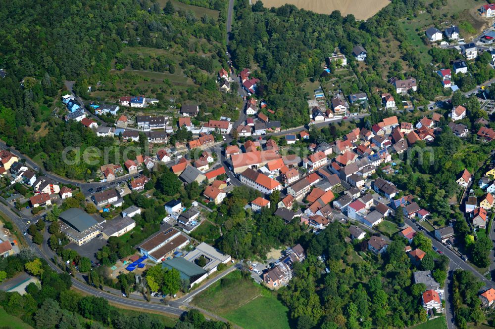 Oberdürrbach from the bird's eye view: Surrounded by forest and forest areas center of the streets and houses and residential areas in Oberdürrbach in the state Bavaria, Germany