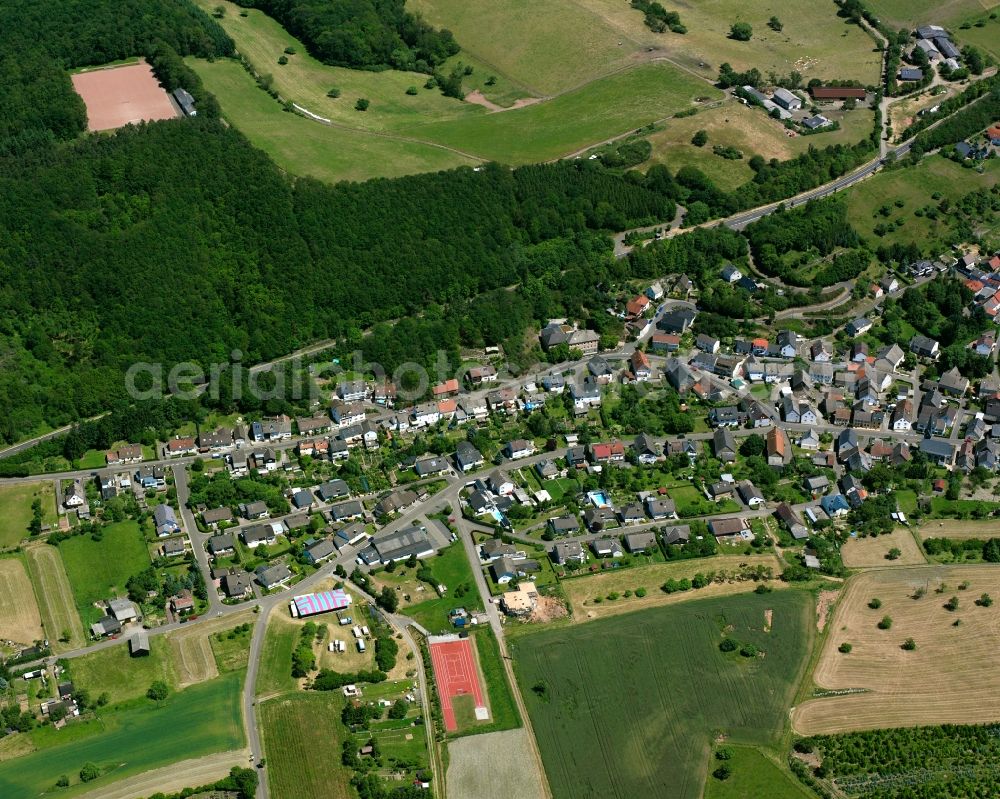 Aerial image Oberreidenbach - Surrounded by forest and forest areas center of the streets and houses and residential areas in Oberreidenbach in the state Rhineland-Palatinate, Germany