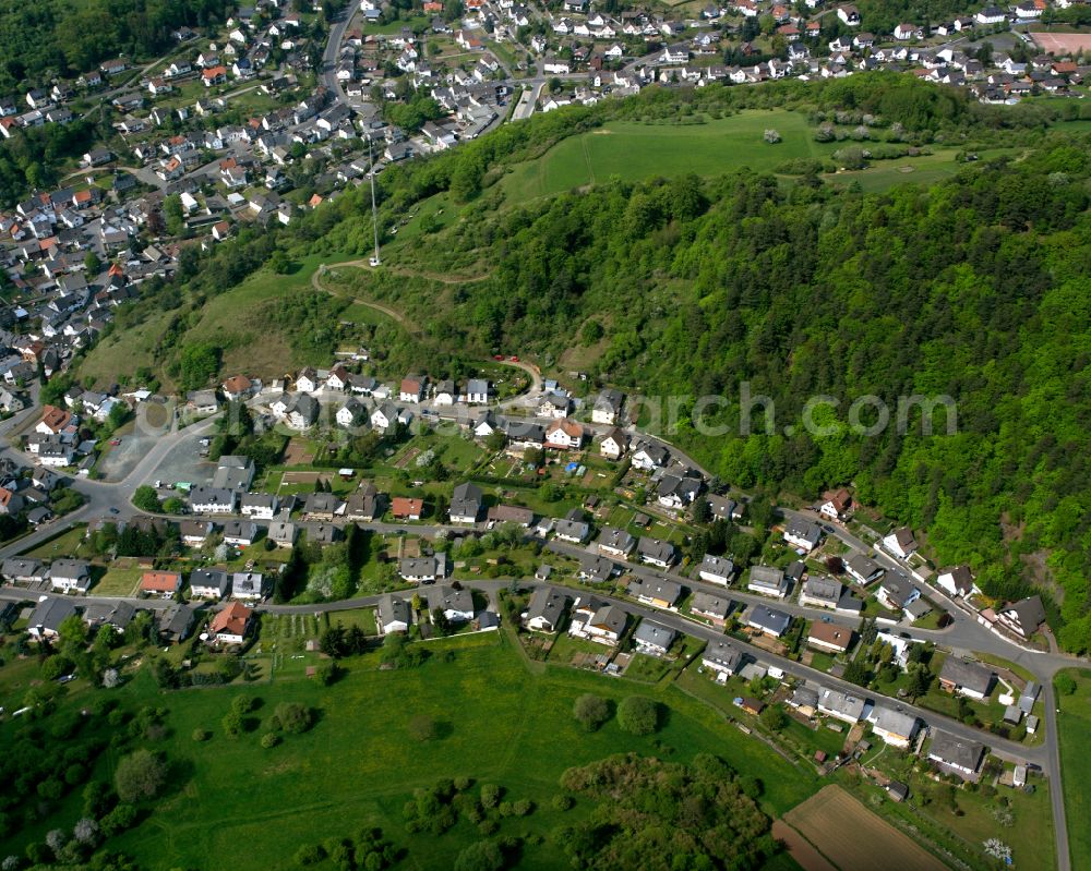 Aerial photograph Oberscheld - Surrounded by forest and forest areas center of the streets and houses and residential areas in Oberscheld in the state Hesse, Germany