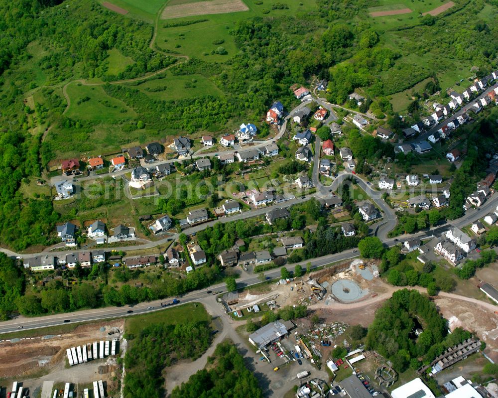 Oberscheld from above - Surrounded by forest and forest areas center of the streets and houses and residential areas in Oberscheld in the state Hesse, Germany