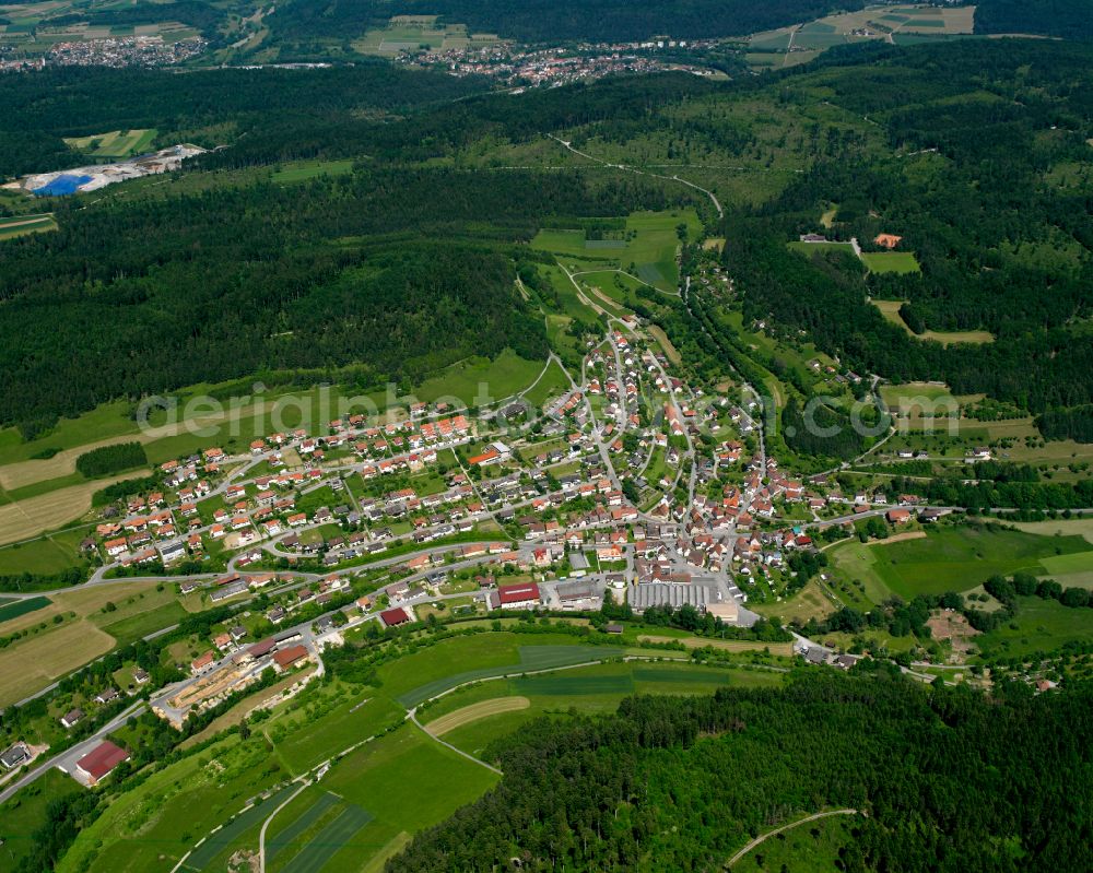 Aerial image Oberschwandorf - Surrounded by forest and forest areas center of the streets and houses and residential areas in Oberschwandorf in the state Baden-Wuerttemberg, Germany