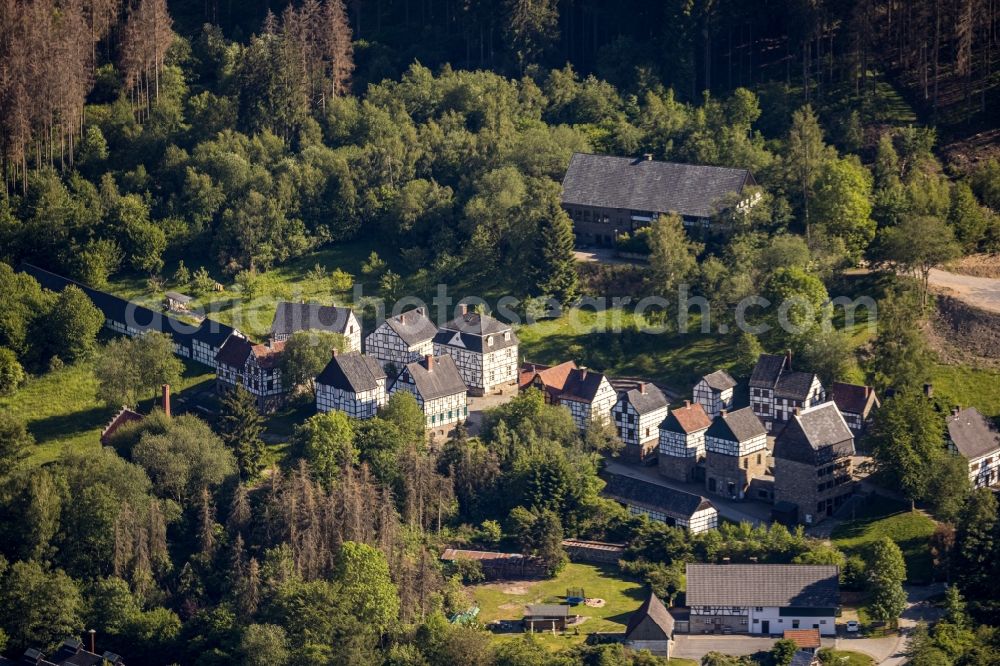 Aerial image Hagen - Surrounded by forest and forest areas center of the streets and houses and residential areas in the district Dahl in Hagen in the state North Rhine-Westphalia, Germany