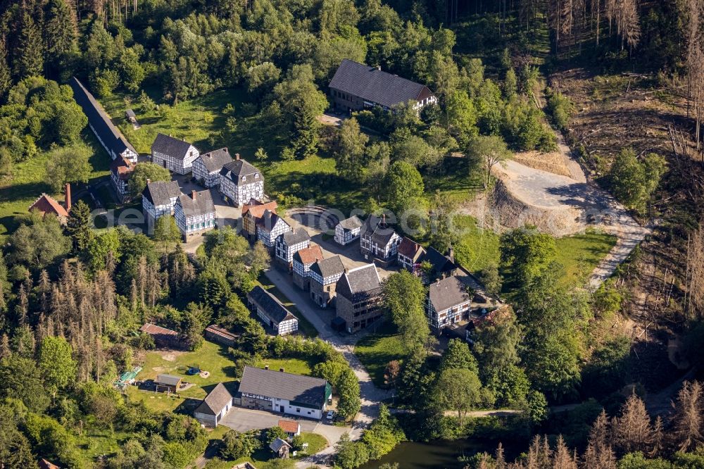 Hagen from above - Surrounded by forest and forest areas center of the streets and houses and residential areas in the district Dahl in Hagen in the state North Rhine-Westphalia, Germany