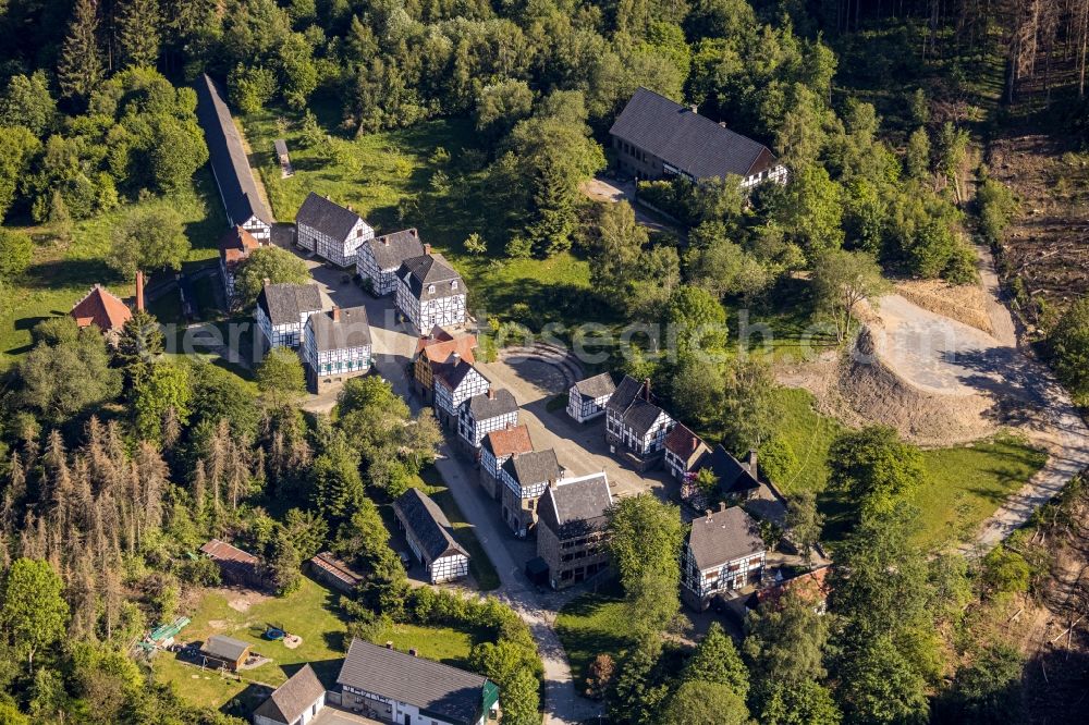 Hagen from the bird's eye view: Surrounded by forest and forest areas center of the streets and houses and residential areas in the district Dahl in Hagen in the state North Rhine-Westphalia, Germany