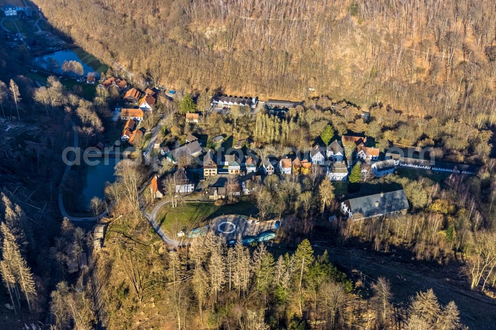 Aerial image Hagen - Surrounded by forest and forest areas center of the streets and houses and residential areas in the district Dahl in Hagen in the state North Rhine-Westphalia, Germany