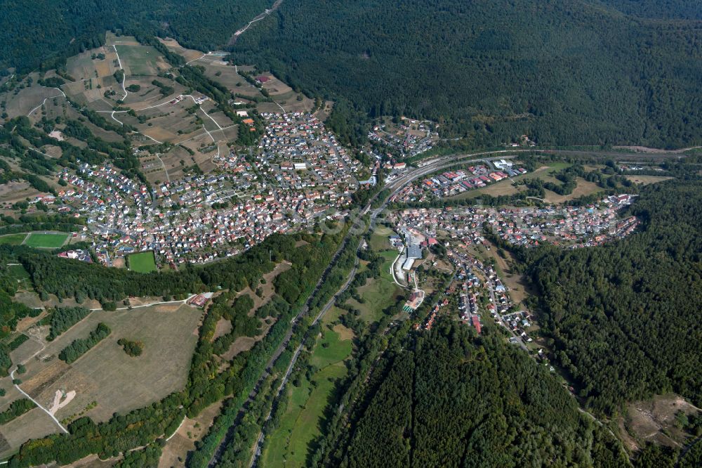 Partenstein from the bird's eye view: Surrounded by forest and forest areas center of the streets and houses and residential areas in Partenstein in the state Bavaria, Germany