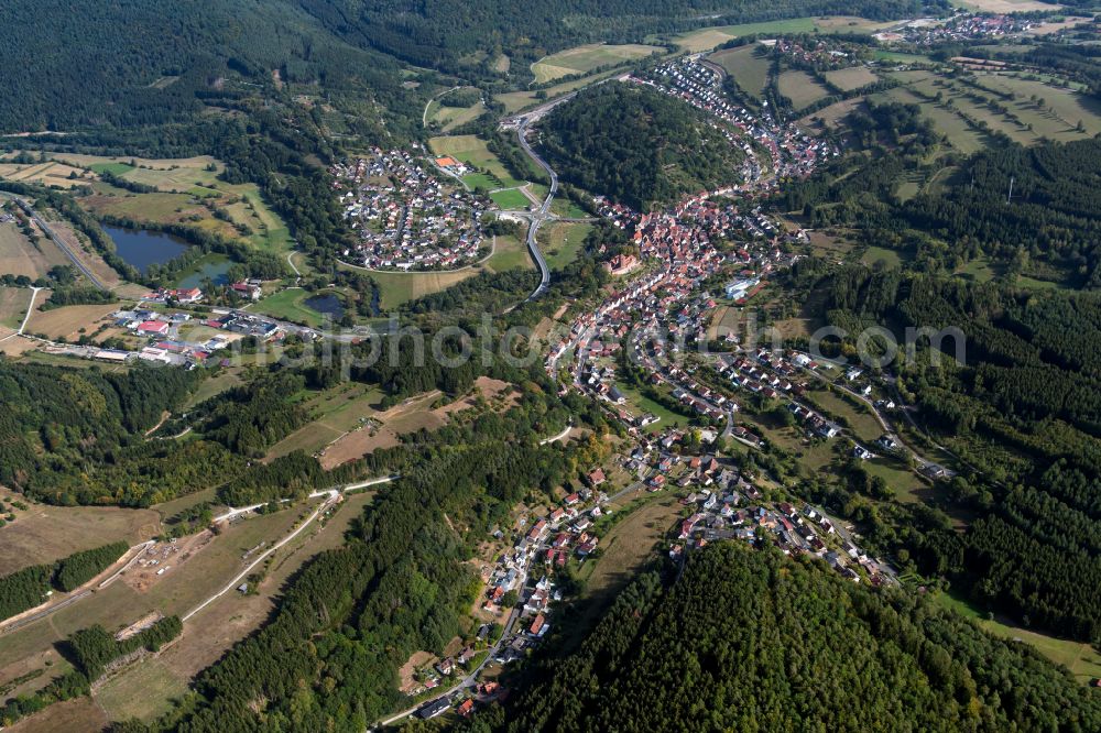 Rieneck from above - Surrounded by forest and forest areas center of the streets and houses and residential areas in Rieneck in the state Bavaria, Germany