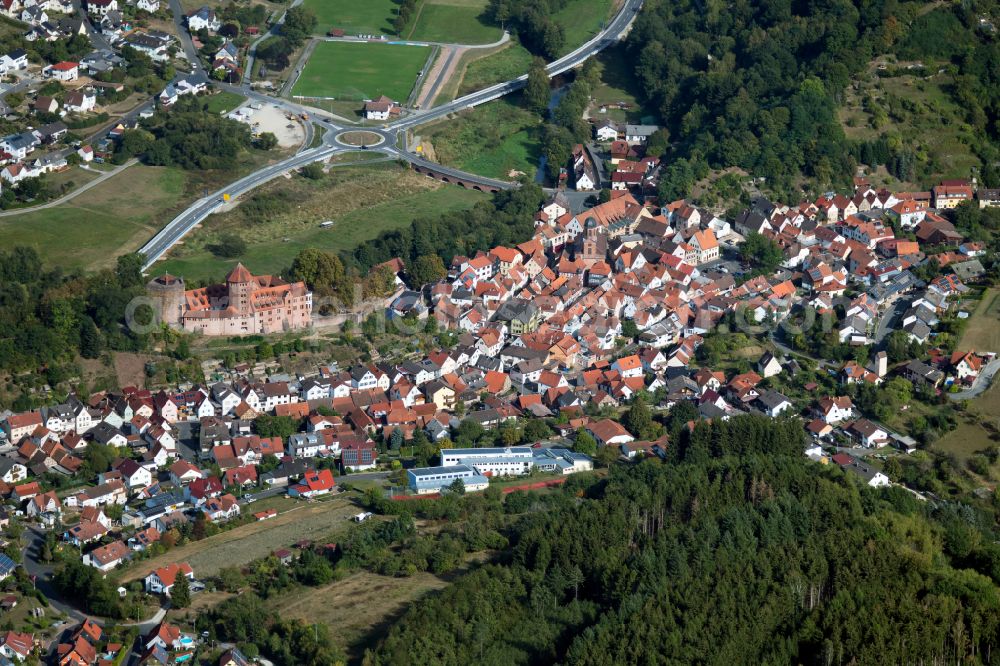 Rieneck from the bird's eye view: Surrounded by forest and forest areas center of the streets and houses and residential areas in Rieneck in the state Bavaria, Germany