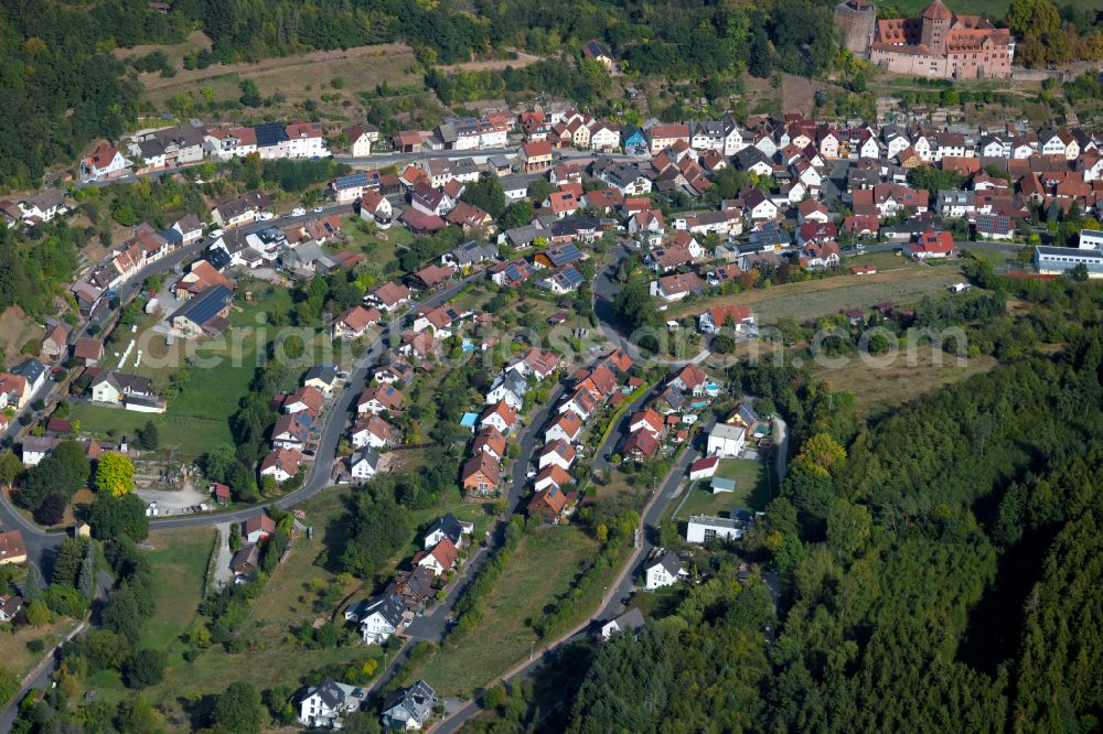 Aerial photograph Rieneck - Surrounded by forest and forest areas center of the streets and houses and residential areas in Rieneck in the state Bavaria, Germany