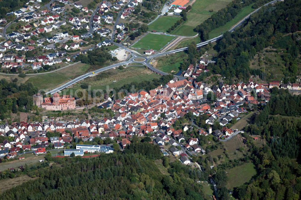 Rieneck from above - Surrounded by forest and forest areas center of the streets and houses and residential areas in Rieneck in the state Bavaria, Germany