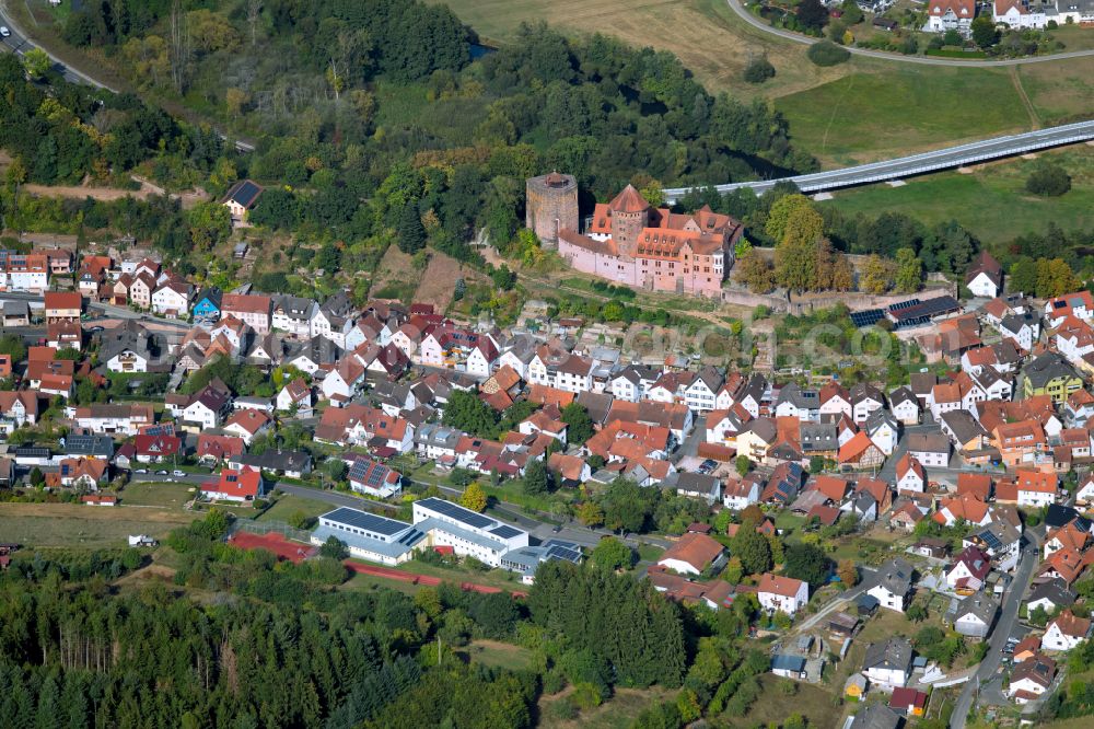 Rieneck from the bird's eye view: Surrounded by forest and forest areas center of the streets and houses and residential areas in Rieneck in the state Bavaria, Germany