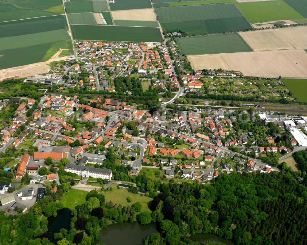 Aerial image Ringelheim - Surrounded by forest and forest areas center of the streets and houses and residential areas in Ringelheim in the state Lower Saxony, Germany