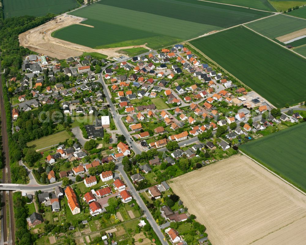 Aerial photograph Ringelheim - Surrounded by forest and forest areas center of the streets and houses and residential areas in Ringelheim in the state Lower Saxony, Germany