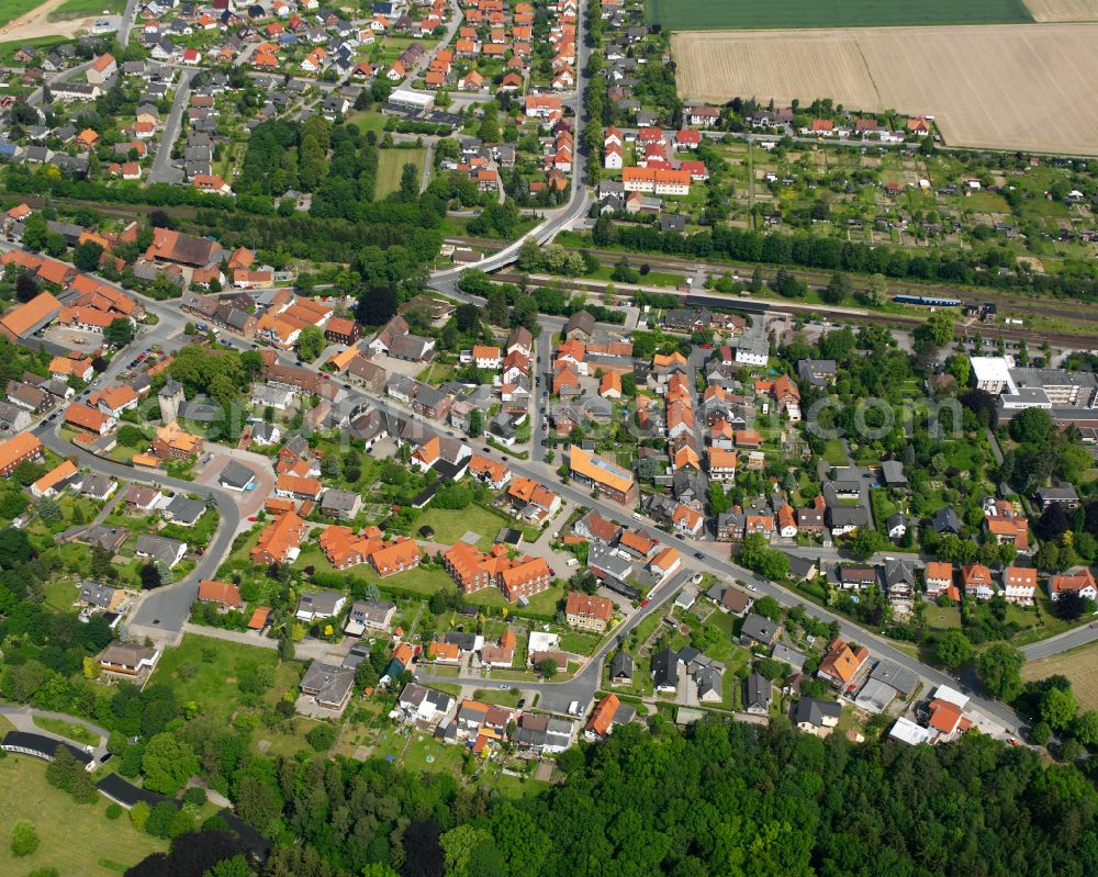 Ringelheim from above - Surrounded by forest and forest areas center of the streets and houses and residential areas in Ringelheim in the state Lower Saxony, Germany