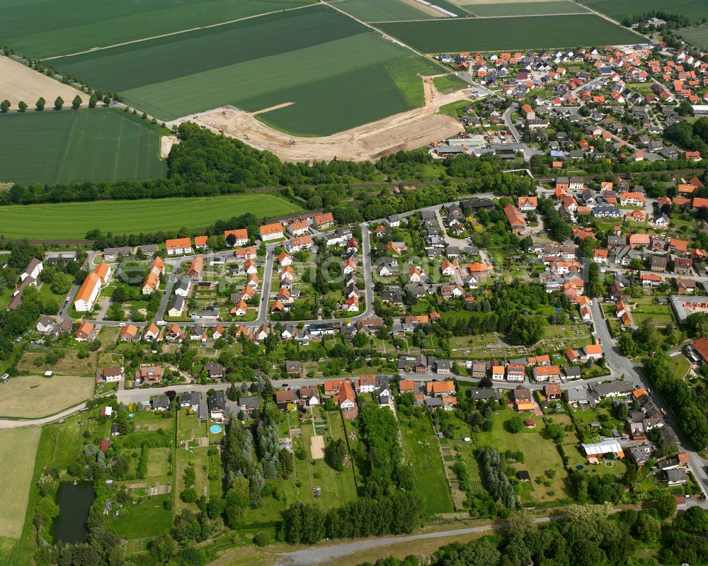 Aerial image Ringelheim - Surrounded by forest and forest areas center of the streets and houses and residential areas in Ringelheim in the state Lower Saxony, Germany