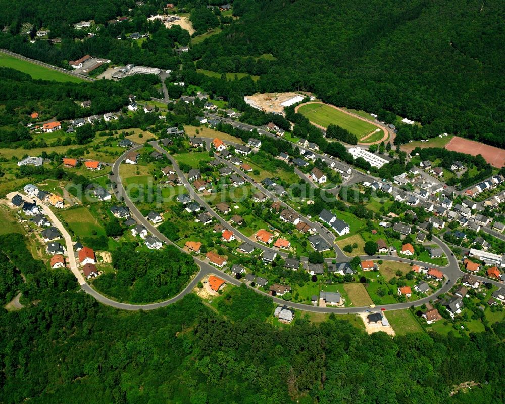 Tiefenstein from above - Surrounded by forest and forest areas center of the streets and houses and residential areas in Tiefenstein in the state Rhineland-Palatinate, Germany