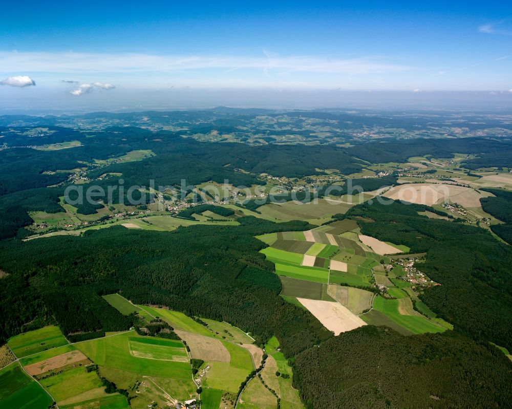 Aerial photograph Unter-Mossau - Surrounded by forest and forest areas center of the streets and houses and residential areas in Unter-Mossau in the state Hesse, Germany