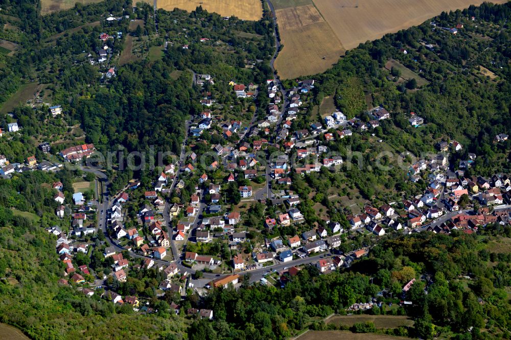 Aerial photograph Unterdürrbach - Surrounded by forest and forest areas center of the streets and houses and residential areas in Unterdürrbach in the state Bavaria, Germany