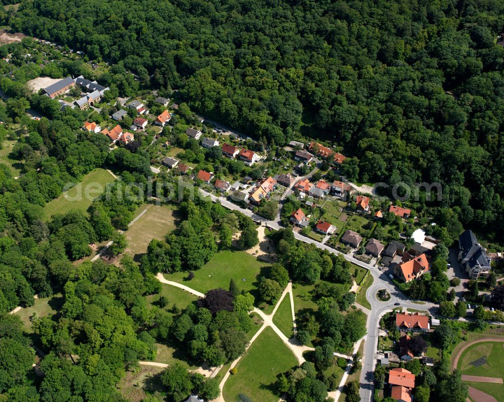 Wernigerode from above - Surrounded by forest and forest areas center of the streets and houses and residential areas in Wernigerode in the Harz in the state Saxony-Anhalt, Germany