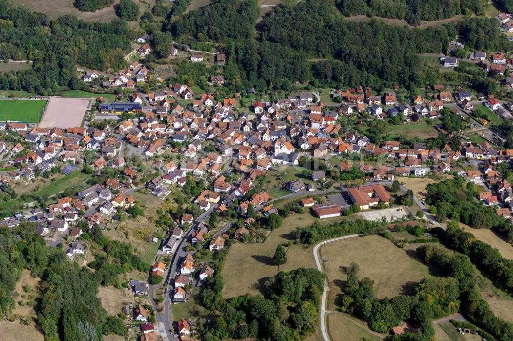 Wiesthal from above - Surrounded by forest and forest areas center of the streets and houses and residential areas in Wiesthal in the state Bavaria, Germany