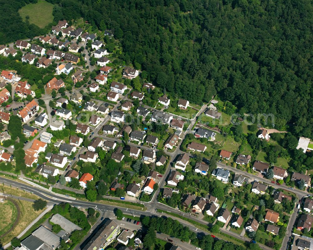 Aerial image Wolfartsweier - Surrounded by forest and forest areas center of the streets and houses and residential areas in Wolfartsweier in the state Baden-Wuerttemberg, Germany