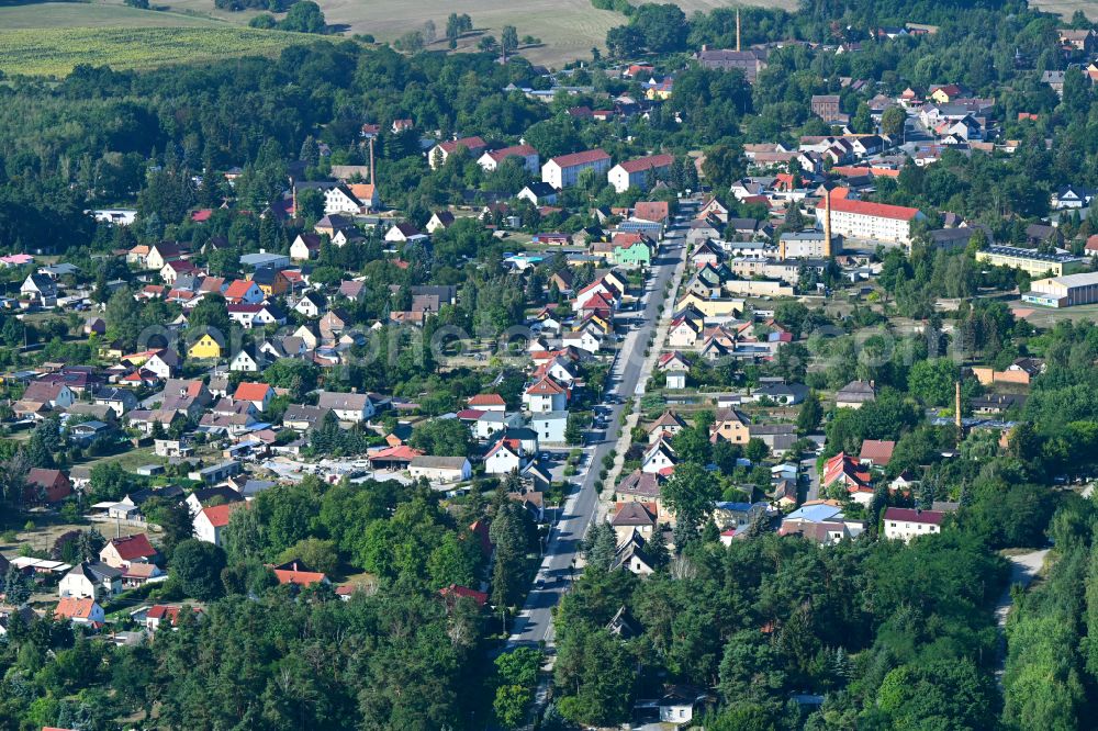 Crinitz from above - Urban area with outskirts and inner city area surrounded by woodland and forest areas on street Hauptstrasse in Crinitz in the state Brandenburg, Germany