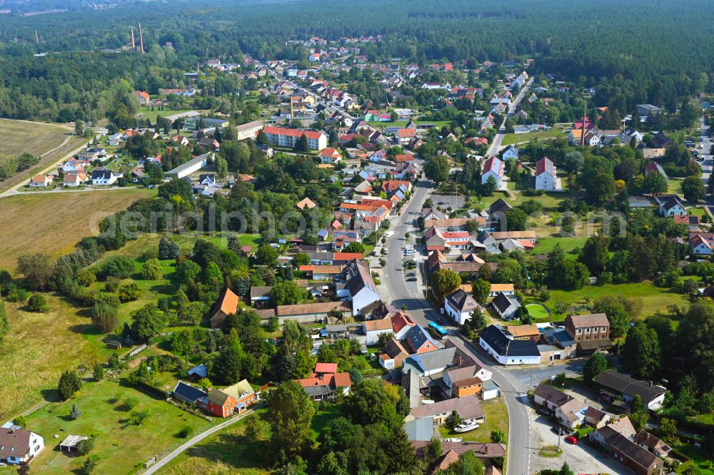 Crinitz from the bird's eye view: Urban area with outskirts and inner city area surrounded by woodland and forest areas on street Hauptstrasse in Crinitz in the state Brandenburg, Germany