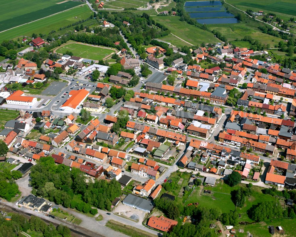 Hasselfelde from the bird's eye view: Urban area with outskirts and inner city area surrounded by woodland and forest areas in Hasselfelde in the state Saxony-Anhalt, Germany