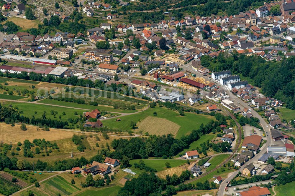 Oppenau from above - Urban area with outskirts and inner city area surrounded by woodland and forest areas in Oppenau in the state Baden-Wuerttemberg, Germany