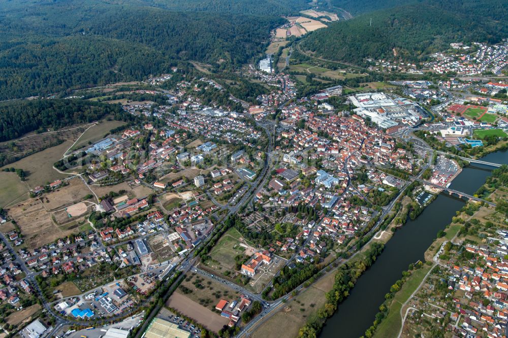 Wombach from above - Urban area with outskirts and inner city area surrounded by woodland and forest areas in Wombach in the state Bavaria, Germany