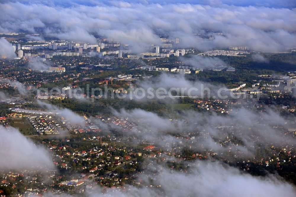 Berlin from above - Cityscape traversed by clouds overlooking the districts of Koepenick, Kaulsdorf and Biesdorf with a view of highrises in the Marzahn- Hellersdorf district of Berlin