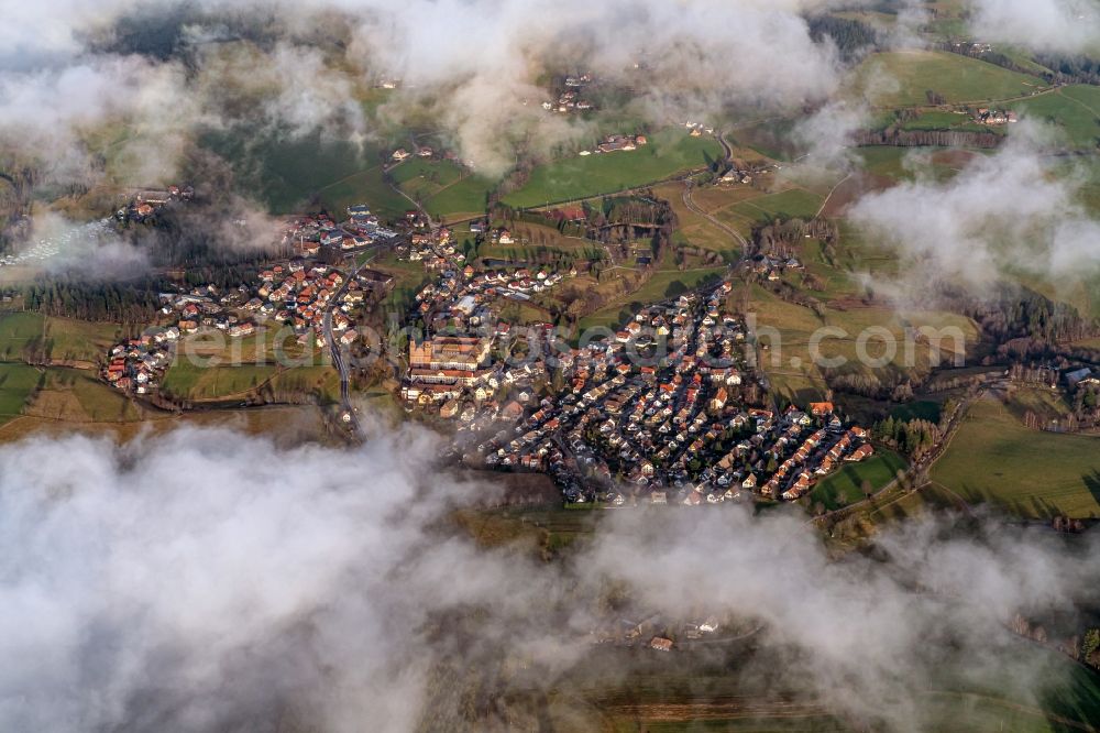 Aerial photograph Sankt Peter - Surrounded by clouds and forest areas center of the streets and houses and residential areas in Sankt Peter in the state Baden-Wurttemberg, Germany