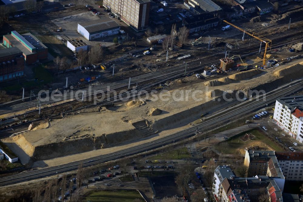 Aerial photograph Berlin - Preparations for the construction of the bridge to the South Stand at the station Ostkreuz in Berlin-Friedrichshain are well advanced. Good to see the heaped mound