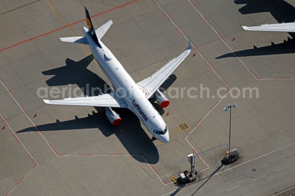 Aerial photograph Stuttgart - Passenger aircraft parked due to the crisis and pandemic on the parking position - parking area at the airport in Stuttgart during the corona lockdown in the state Baden-Wuerttemberg, Germany