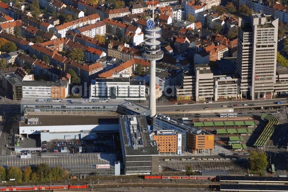 Aerial photograph Hannover - Blick auf den Hannoveraner Stadtteil Mitt und den VW-Tower neben dem Hauptbahnhof Hannover. Ursprünglich war der Tower ein Fernmeldeturm der Deutschen Bundespost. Als die Volkswagen AG im Jahr 200 den Turm erwarb, brachte sie ihr Logo an der Turmspitze an. Somit ist es der VW-Tower. Kontakt: Volkswagen AG Nutzfahrzeuge Werk Hannover Rolf Ohlinger Umweltschutzbeauftragter, Brieffach 2399 30405 Hannover, Tel. +49(0)511 798 4247, Email: rolf.ohlinger@volkswagen.de