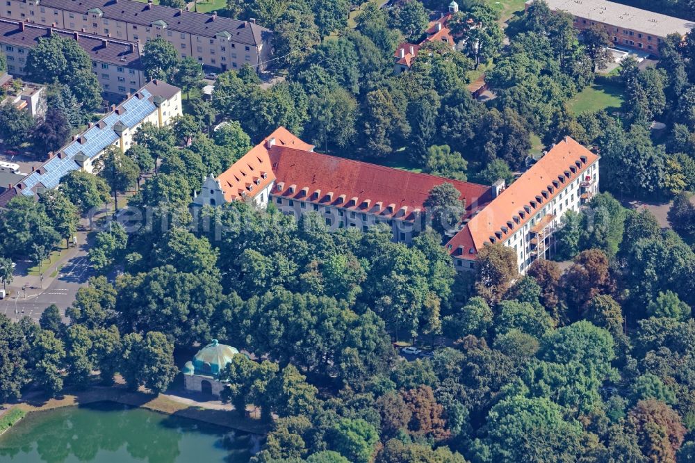 Aerial photograph München - Waisenhaus in Munich Neuhausen in the state of Bavaria. The building, built in the style of an old Bavarian baroque monastery, is located at the end of the Nymphenburger Kanal. The orphanage is an institution of modern child and youth care with a healing pedagogic mission