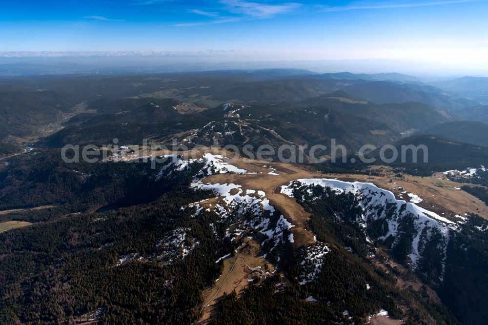 Aerial photograph Feldberg (Schwarzwald) - Forest and mountain scenery in the Black Forest with last snow fields on the summit of mount Feldberg and Herzogenhorn in Feldberg (Black Forest) in the state Baden-Wurttemberg, Germany