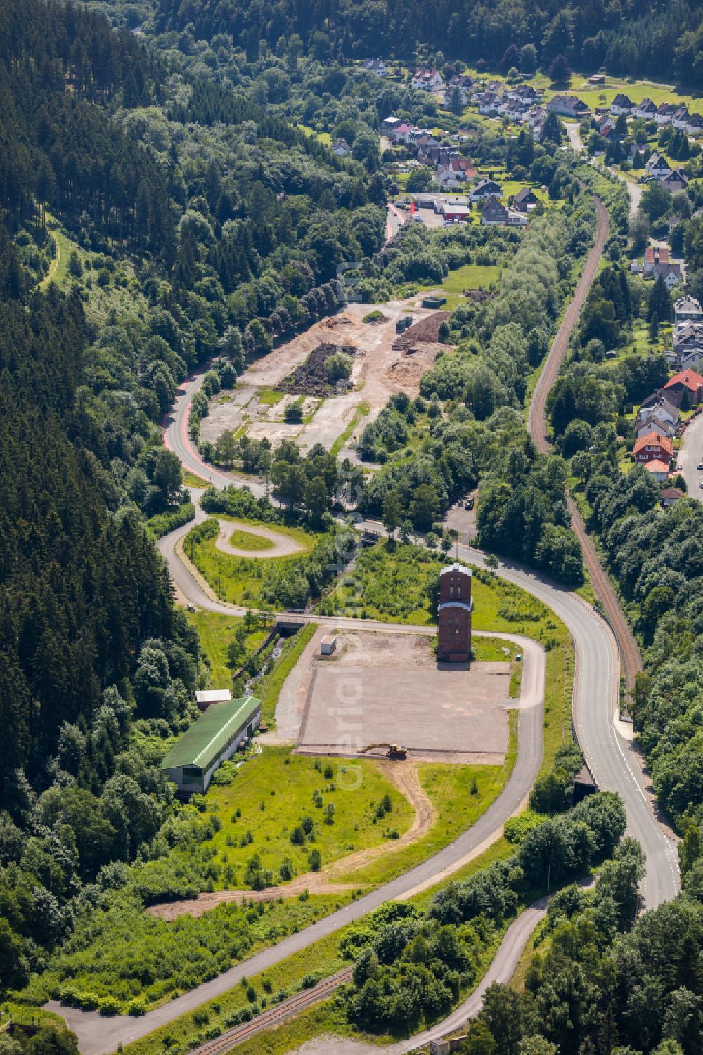 Brilon from above - Industrial and commercial area in the middle of a wooded area on street Kirchweg in Brilon at Sauerland in the state North Rhine-Westphalia, Germany