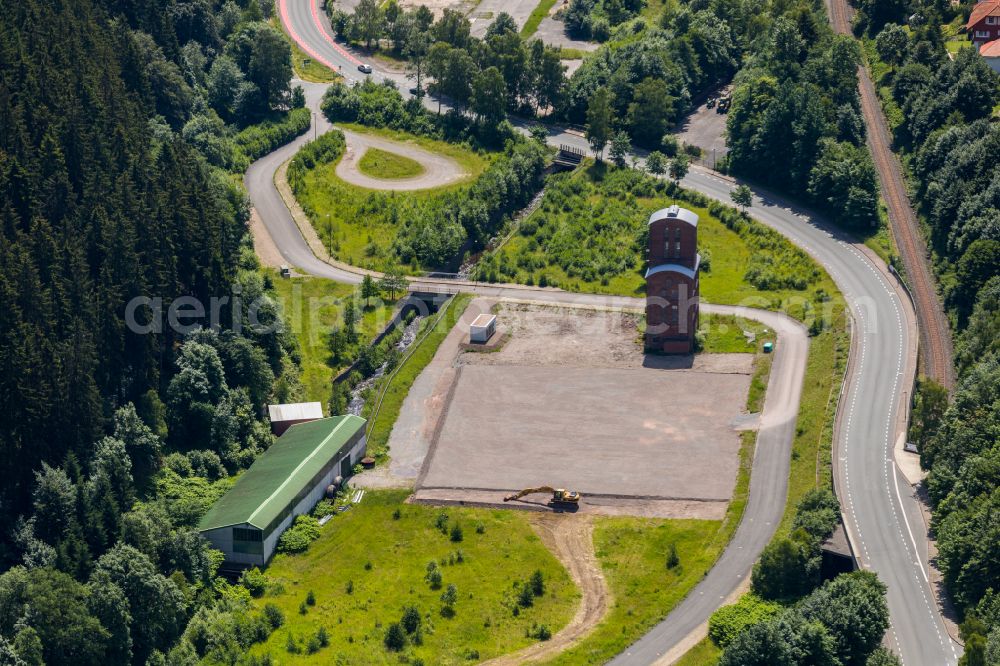 Brilon from the bird's eye view: Industrial and commercial area in the middle of a wooded area on street Kirchweg in Brilon at Sauerland in the state North Rhine-Westphalia, Germany