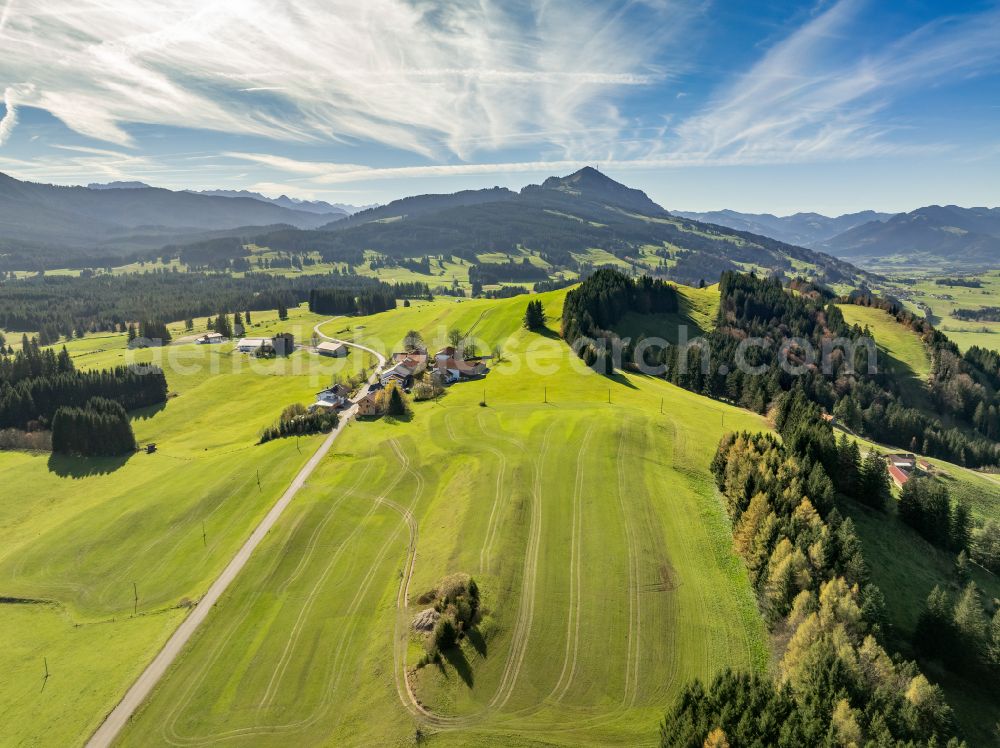 Oberellegg from above - Meadows and grass areas surround forest areas in the forest areasand pastureland in Oberellegg Allgaeu in the state Bavaria, Germany