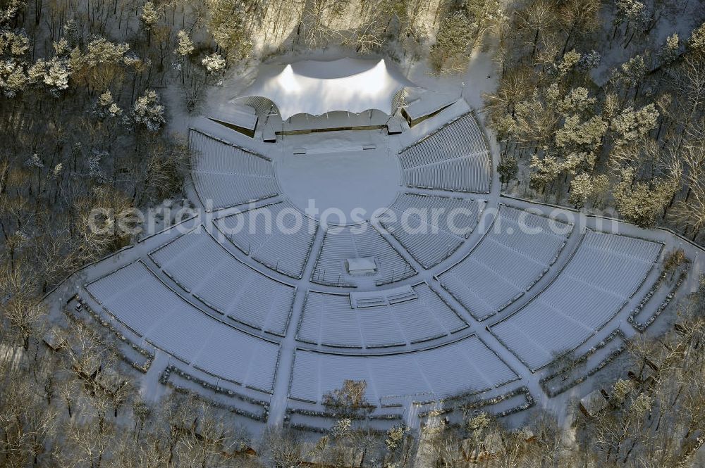 Berlin from above - Blick auf die winterlich mit Schnee bedeckte Waldbühne im Bezirk Charlottenburg-Wilmersdorf in Berlin. Die Bühne gilt als eine der schönsten Freilichtbühnen Europas und liegt westlich des Olympiageländes. View of the wintery snow-covered Waldbuhne in the district of Charlottenburg-Wilmersdorf in Berlin.